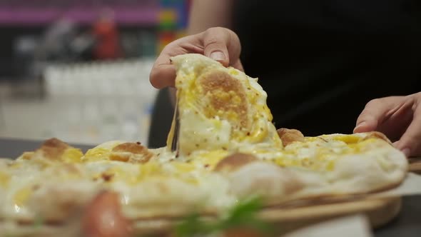 Woman Takes Slice Of Appetizing Pizza With Cheese