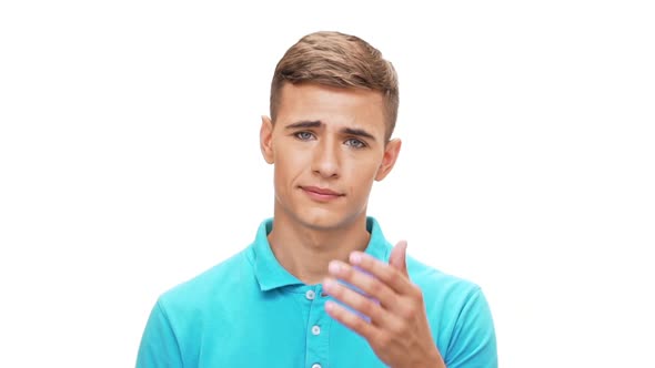 Upset Young Man Shruging Grab His Face Over White Background Slow Motion