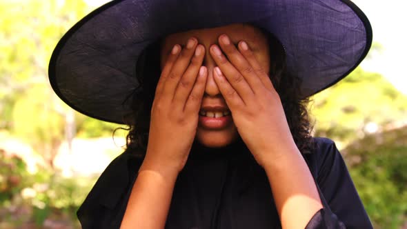 Girl pretending to be a witch