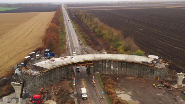 Panoramic Drone Shot Along Construction of Road Concrete Overpass