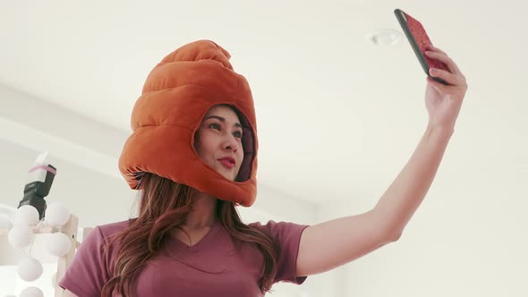 Woman enjoying a doll garden selfie on her head before traveling