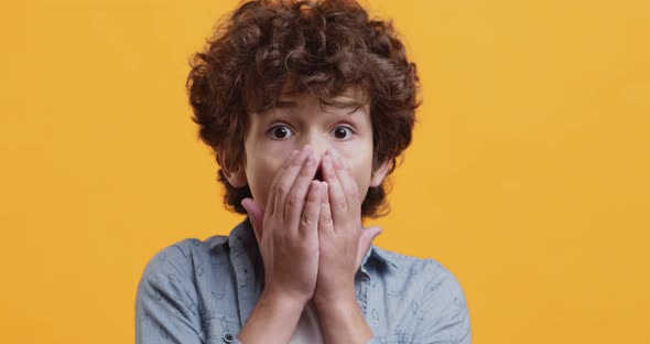 Unbelievable. Close Up Portrait of Amazed Boy Opening Mouth in Shock