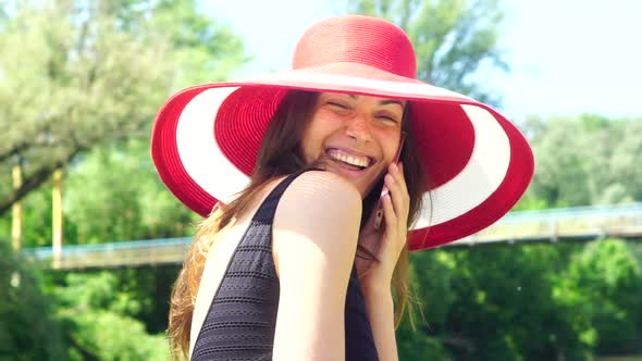 Smiling Woman Talking on Phone Outdoor