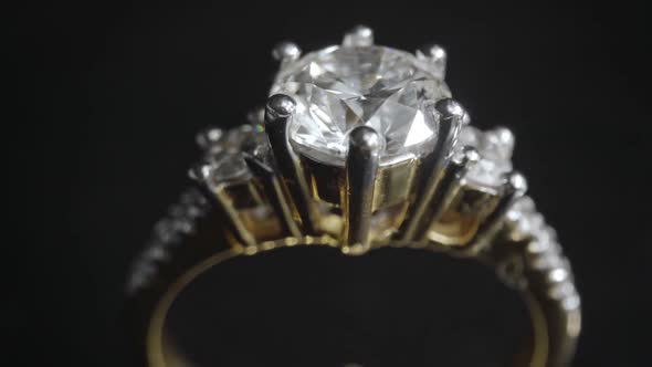 Extreme Detailed of Diamond Ring Close Up Shot While Rotating on Dark Background