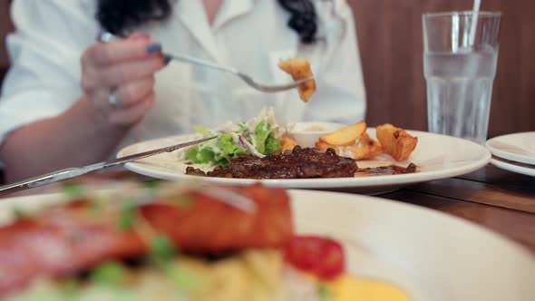 Young Woman Eating Delicious Lasso Watered with Passion Fruit Saucegirl Eating Mashed Potatoes and