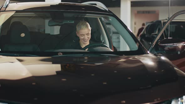 Woman Driving a New Car