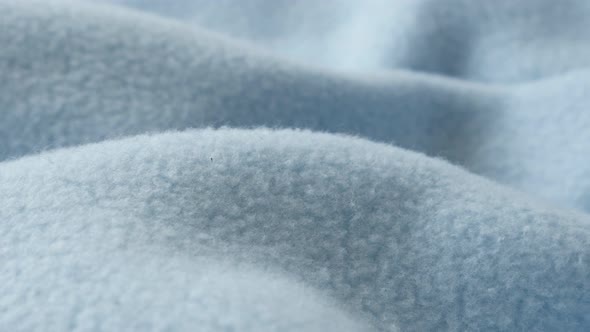 Blue blanket made of polar fleece slow pan 4K video