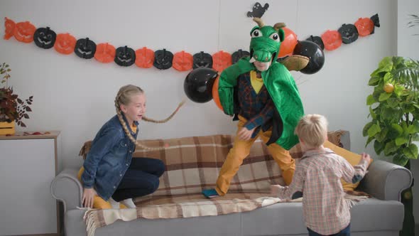 Three Friends are Playing Catchup at Room Boys and Girl Running Around the House with Decorations