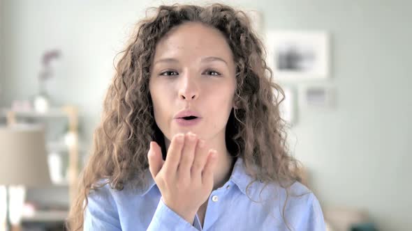 Flying Kiss By Curly Hair Woman in Love