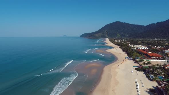 Brazilian Maresias beach landmark. Tropical summer beach.