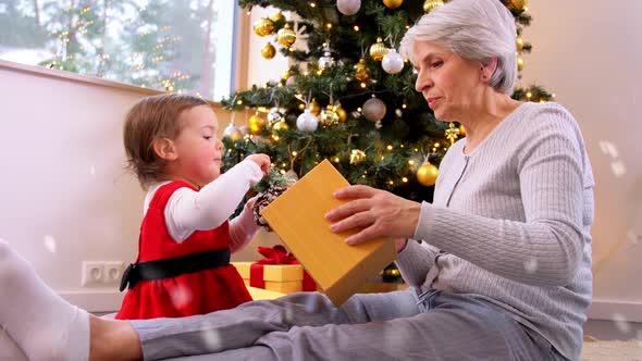 Grandmother and Baby Girl with Christmas Gifts