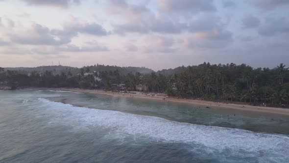 Coastline with Sandy Beaches and Palm Trees Silhouettes