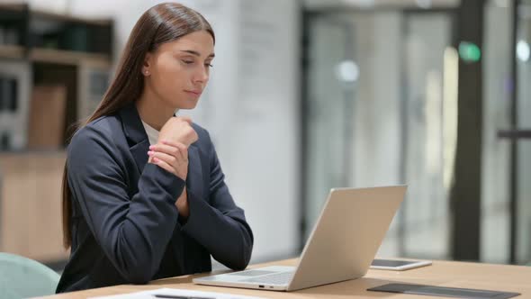 Sick Businesswoman with Laptop Having Wrist Pain in Office