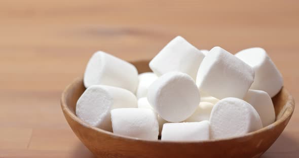 White Marshmallow on Wooden Plate