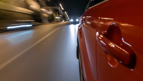 Drivelapse From Side of Car Moving on a Night Avenue in City Timelapse Hyperlapse