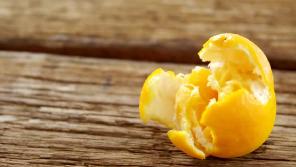 Orange on wooden plank