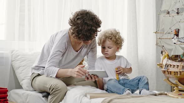 Mother and Son Looking at Tablet