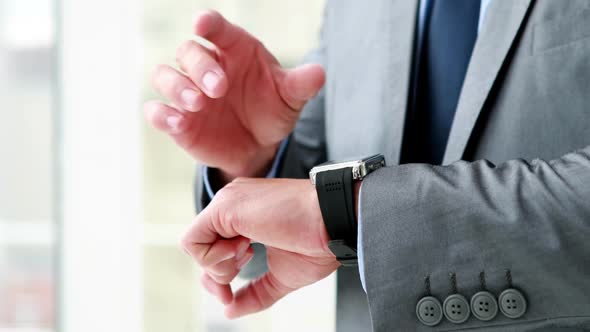 Businessman Using his Smart Watch