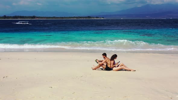 Young Man and Woman on Romantic Honeymoon Have Fun on Beach on Paradise White Sand