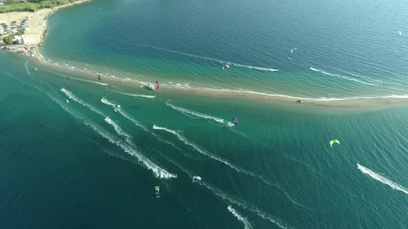 Aerial view of group kitesurfing in the Gulf of Patras, Greece.