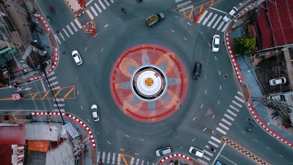 Aerial Shot of Cars Driving at the Circle Road Intersection From Top to Bottom