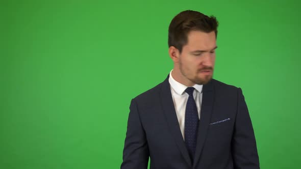 A Young Handsome Businessman Acts Angry - Green Screen Studio