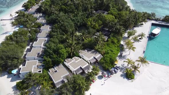 Aerial View of a Tropical Paradise Island Bay Covered in Limestone Trees with Crystal Clear Beach