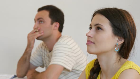 Two Students Listening To the Speaker