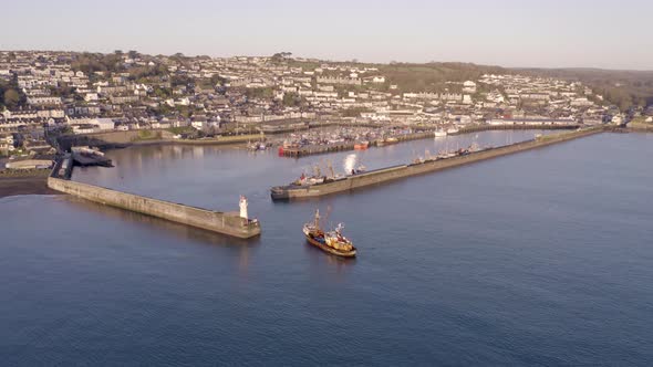 Fishing Boat Returning to Port at Sunrise