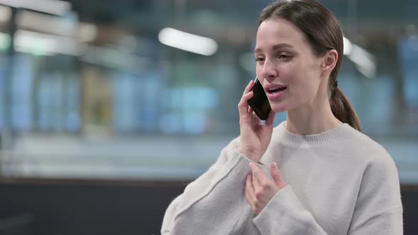 Portrait of Woman Talking on Phone