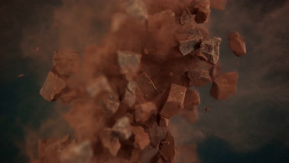 Super Slow Motion Shot of Flying Raw Chocolate Chunks and Cocoa Powder at 1000 Fps