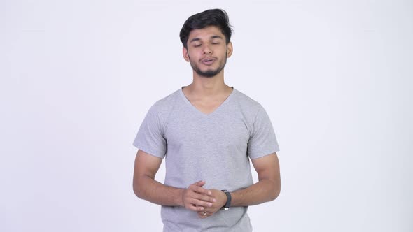 Young Handsome Bearded Indian Man Explaining Something