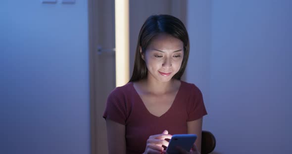 Woman Work on Cellphone at Night 