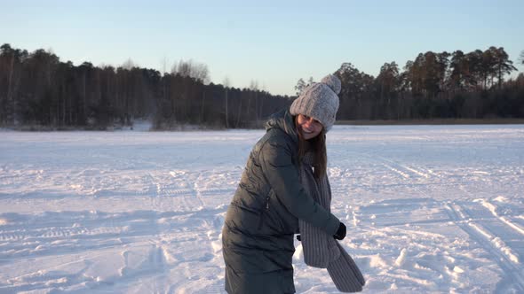 Smiling Girl Enjoying Cold Sunny Evening in the Park