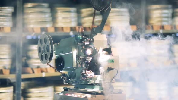 Functioning Film Projector in the Clouds of Smoke