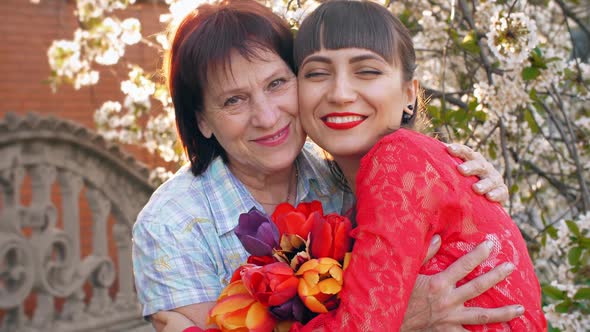 Adult Daughter Hugging Her Mother