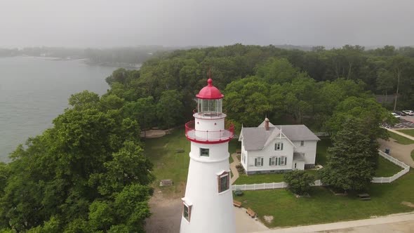 Marblehead Lighthouse along Lake Erie in Ohio drone fly away.