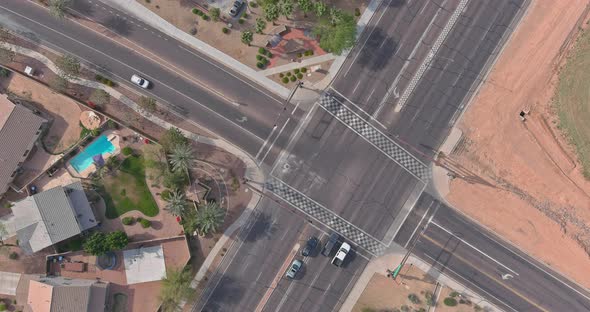 Major Asphalt Road with Multiple Lanes with a Traffic Light a Pedestrian Crossing Seen From Aerial