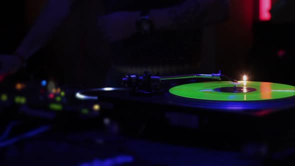 Music Playing on Turntable, Male DJ Working at Club, Dancing