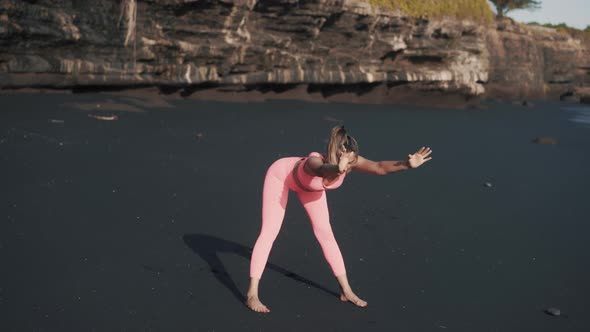 A Young Caucasian Woman in Sportswear Doing Half Slopes at the Seashore