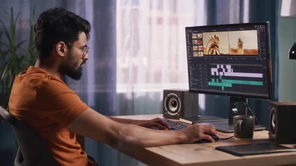 Indian Man Editing Video in Home Office