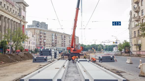 Installing Concrete Plates By Crane at Road Construction Site Timelapse.