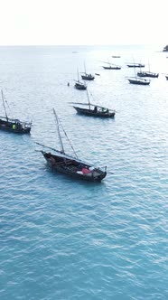 Vertical Video Boats in the Ocean Near the Coast of Zanzibar Tanzania