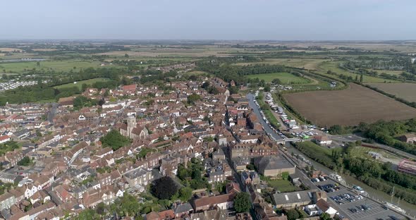 Slow pan above Sandwich Village in Kent, looking down the river