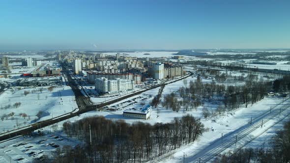 City quarters. Multi-story houses. Winter cityscape. Flight with a camera turn. Aerial photography.