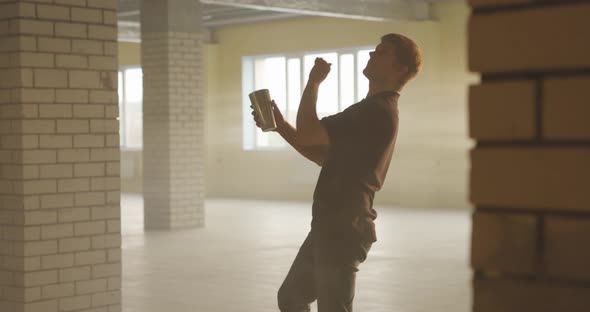 Male Bartender Juggling Bottle and Shaker