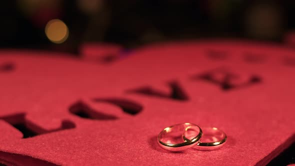 Wedding Rings On Love Letter Heart Shape