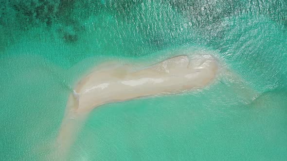 white sand beach, a sandbar in tropical maldives sea, on high tide, crystal clear waters, High angle