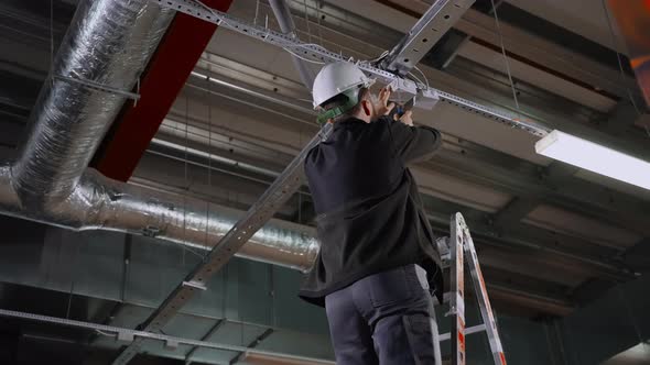 Electrician Installing Junction Boxes