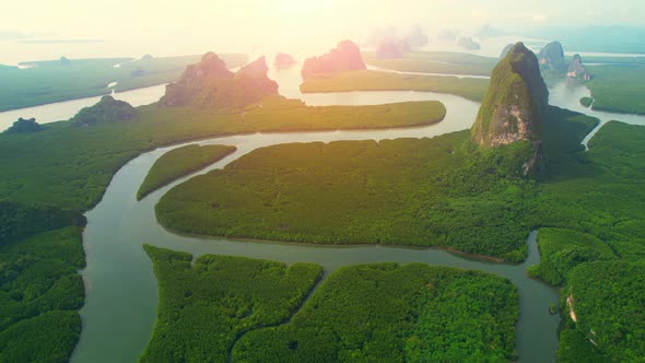 Aerial view from a drone over many islands at Phang Nga Bay during sunset time